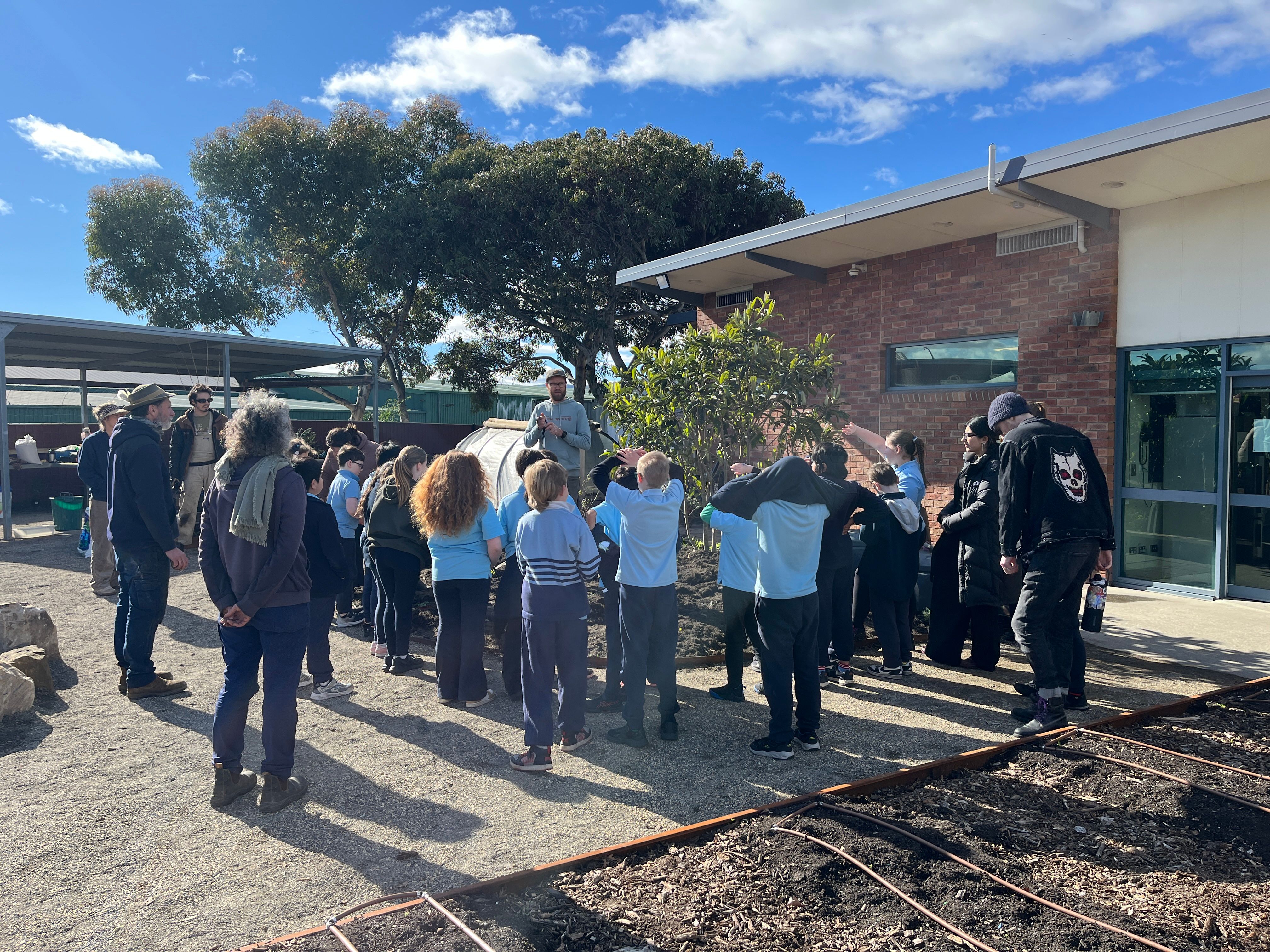 students getting ready to plant in the garden
