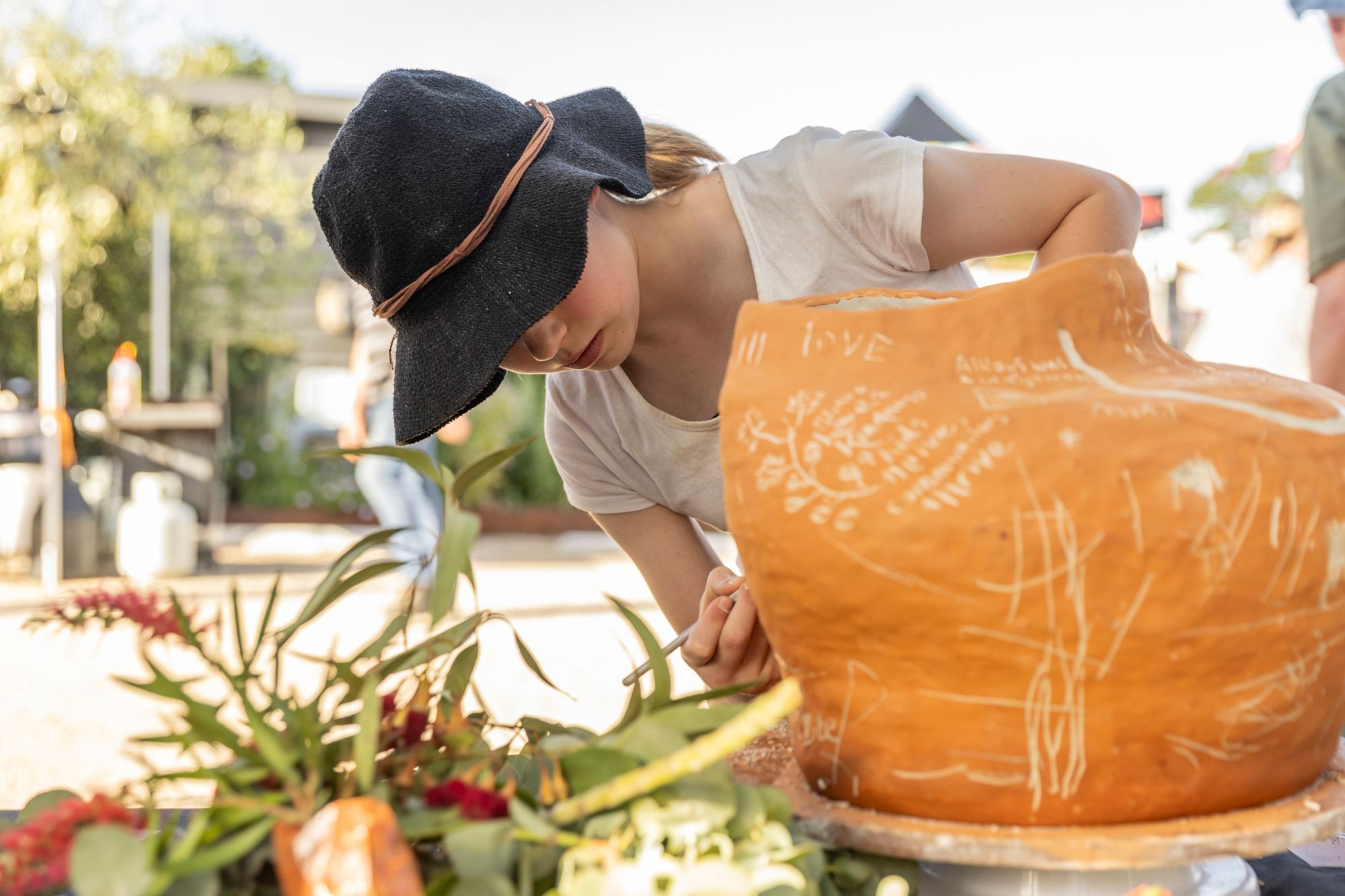 the community pot being scribed
