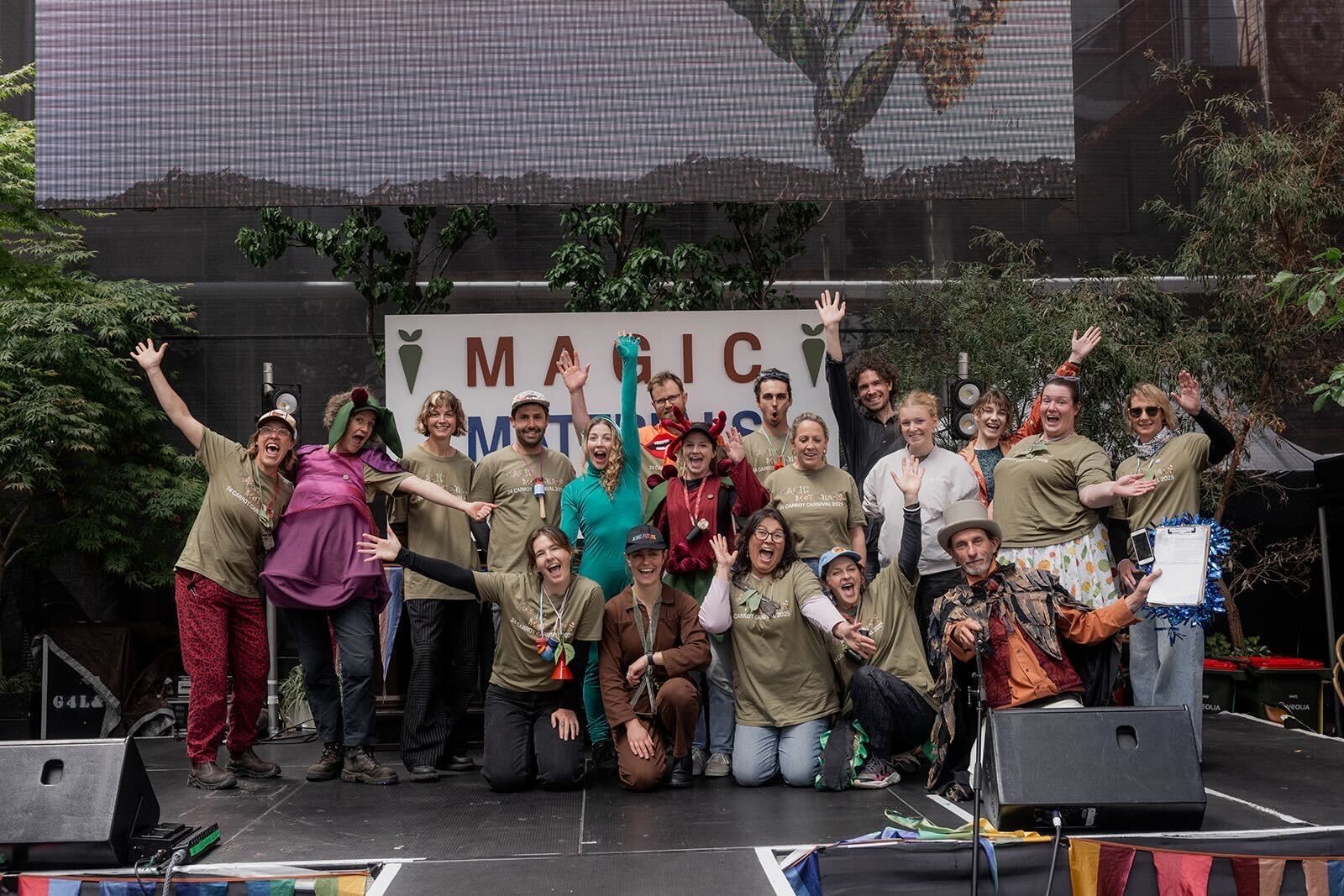 staff photo on a stage at the last 24 carrot carnival