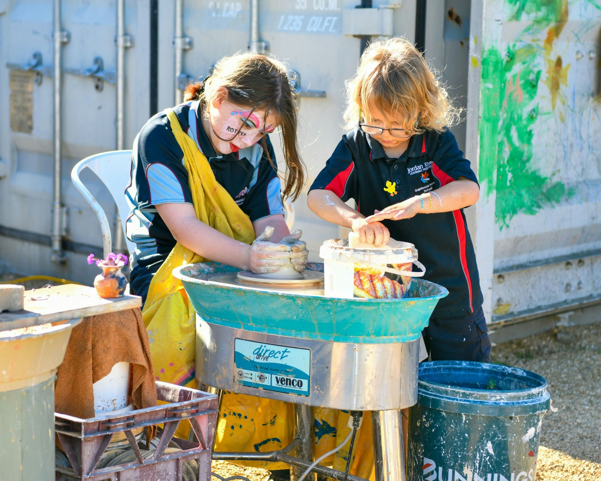 Children on the pottery wheel